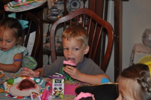 Nora's 3rd birthday - Seth has a cupcake